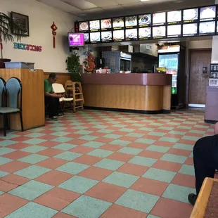 a restaurant with a checkered floor