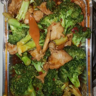 chicken and broccoli in a foil container