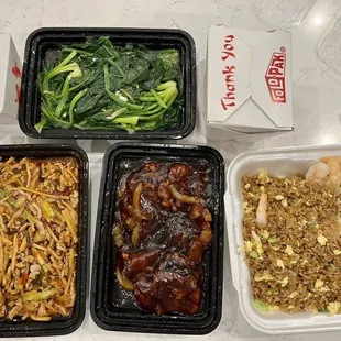 four takeout containers of food