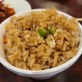 a bowl of rice with peas