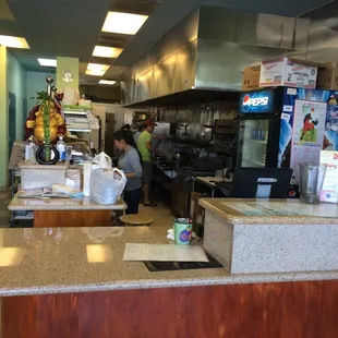 The line of cooks makes short work of the lunch rush