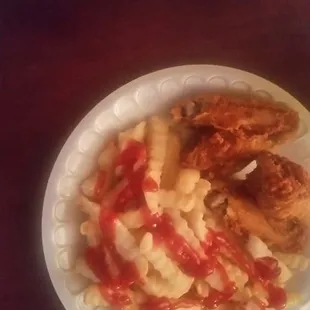 Chicken wings fried hard and a small fry.