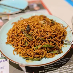 a plate of noodles on a table