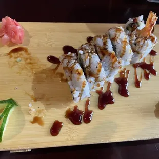 Shrimp Tempura appetizer with one bite already taken.