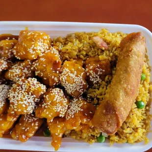 Sesame chicken &amp; egg roll over fried rice
