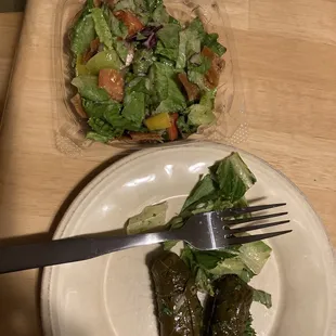 Small fattoush salad and vegetarian grape leaves