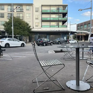 a table and chairs on a city street