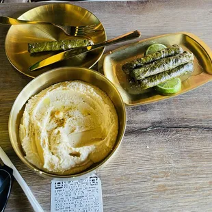 Large hummus and grape leaves