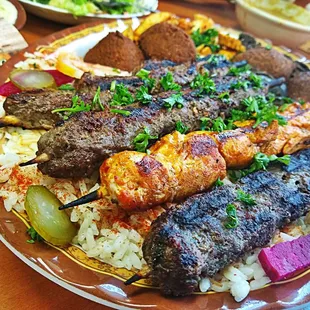 a large platter of meat and rice