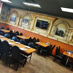 a restaurant with tables and chairs