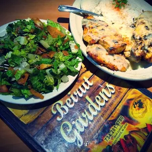 two plates of food and a book