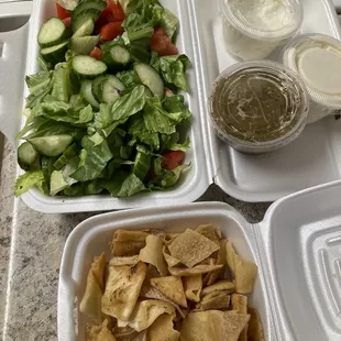 Fattoush Salad with pita chips and salad dressing on the side