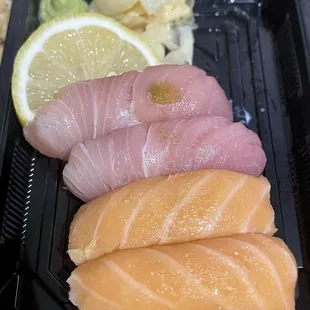 Salmon and yellowtail nigiri (they were supposed to be sashimi; they got it wrong!)