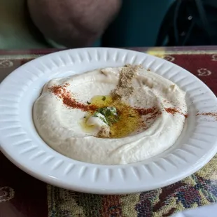 Hummus served before the meal with pita.