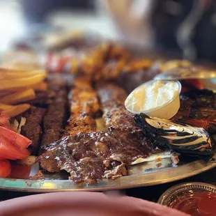 Combo for two: beef kabob, tawouk kabob, kafta kabob, chicken kafta kabob (includes) several sides