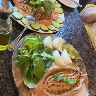 Kibbeh neyya, cracked wheat, raw meat, secret spices. Must have w mint for the perfect bite!