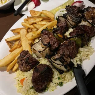 Beef kebab with fries and rice