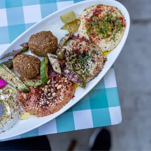 Mezze Sampler - lebna, muhammara, baba ganoush, hummus, pickles, falafel
