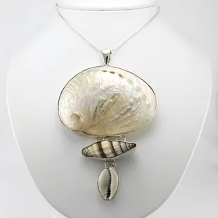 We are in love with this new sterling silver three shell pendant. It definitely is a statement piece for summer.