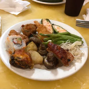 a plate of food on a yellow table