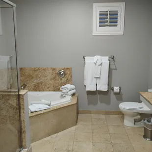 Bathroom with jacuzzi tub his and her sink