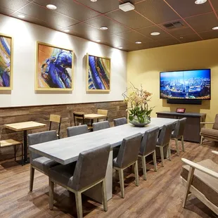 a conference room with tables and chairs