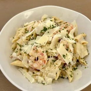 Truffle Penne Pasta - Peas, prosciutto, truffle cream, Parmesan cheese with grilled shrimp.