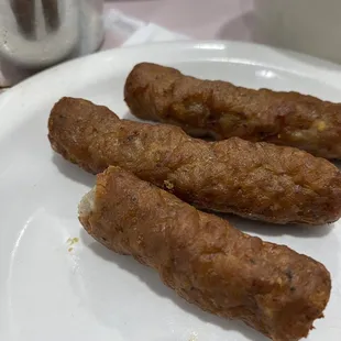 three sausages on a plate