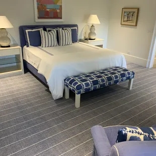 a bedroom with a bed and a couch