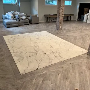 a living room with a couch and a dog