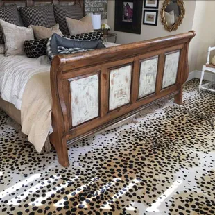 a leopard print rug in a bedroom