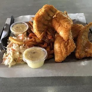 a tray of fried fish and fries