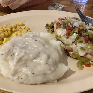 Smothered chicken, potato&apos;s and corn.  Canned corn.  Tasted good, not mushy.  Liked the gravy.