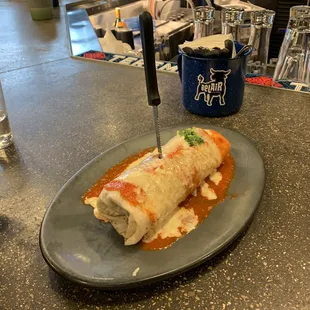 Traditional carne asada wet burrito, stabbed in the back