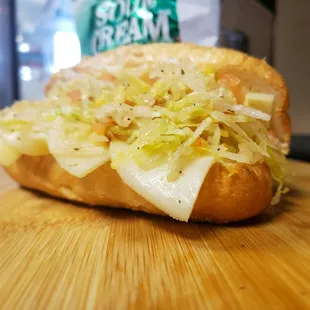 a sub sandwich on a cutting board