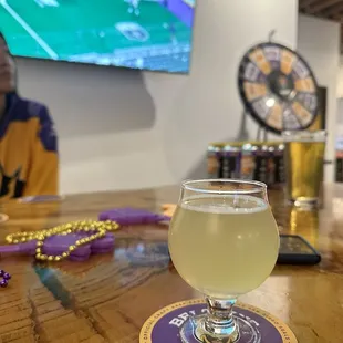 a glass of beer on a table