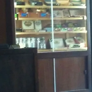 a display of cigars in a glass case