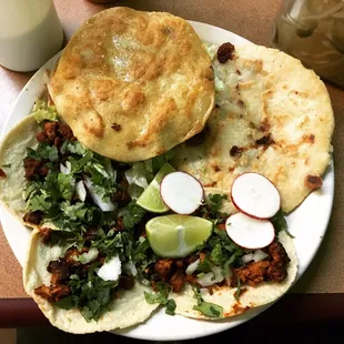 Three tacos, a pupusa, and a gordita. Perfecto!