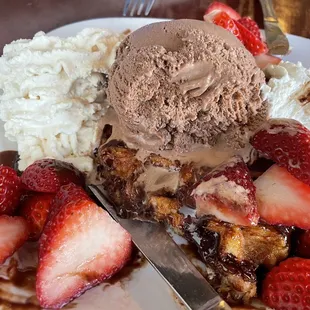 Belgium chocolate waffle with fresh whipped cream and upgraded homemade Belgium chocolate ice cream and fresh strawberries add.