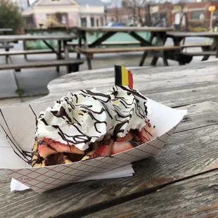 a waffle with chocolate and strawberries