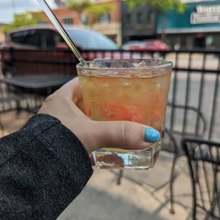 a person holding a drink