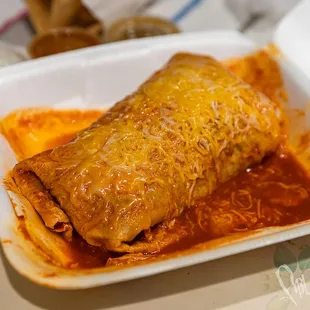 Wet Burrito - Carne Asada, no beans but added avocado with chili rojo sauce. Sour cream and red hot sauce on the side. So good!