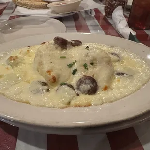 Stuffed shells, Alfredo sauce, and added Italian sausage