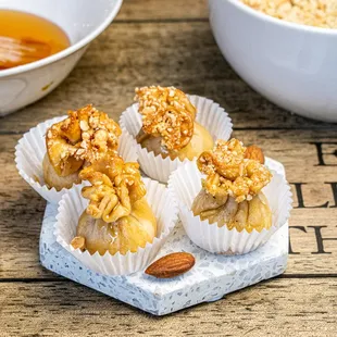 a bowl of honey and a bowl of oatmeal