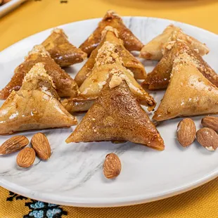 a white plate with almonds on it