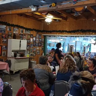 a large group of people sitting at tables