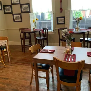 a dining room with tables and chairs