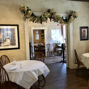 a dining room with a table and chairs