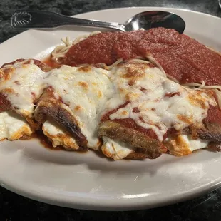 Eggplant Rollitini with side of spaghetti.
