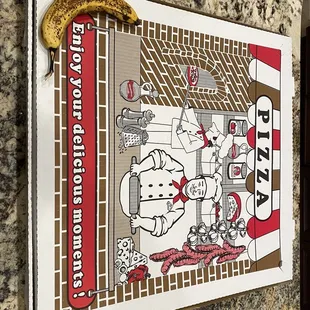 This box barely fit through the door,...see the full-sized banana in the lower left, ya, gigantic pizza!